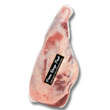 Raw ham with a label on a white background